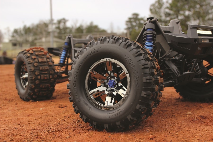 The oversized aluminum bodied shocks come stock, but the Traxxas Sledgehammer tires shown here are optional.