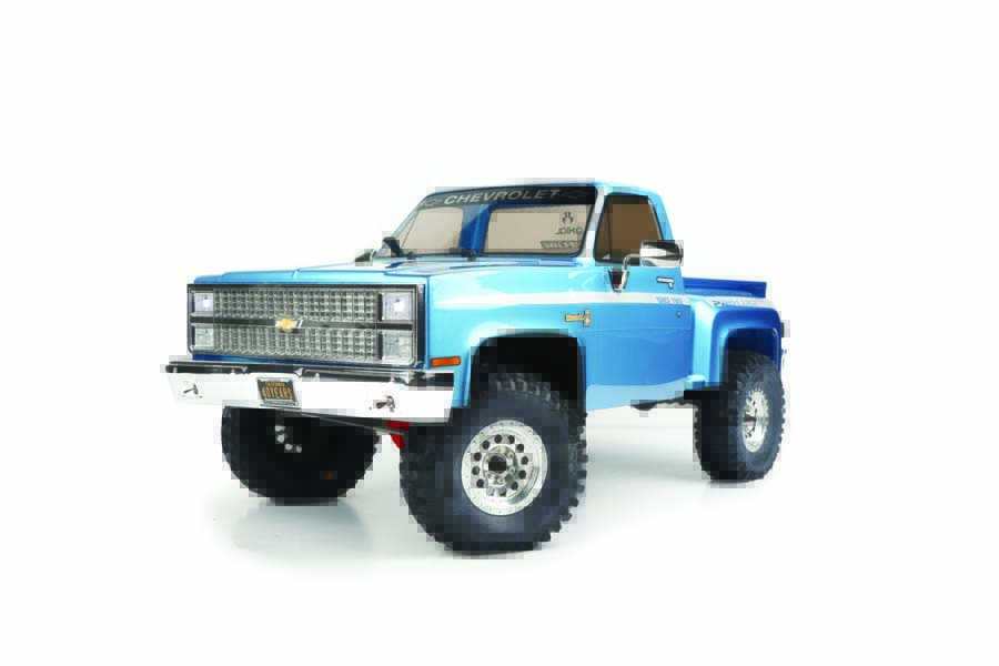 The truck’s detailed grille and bumper are authentic in style to a real 1982 Chevy K10.