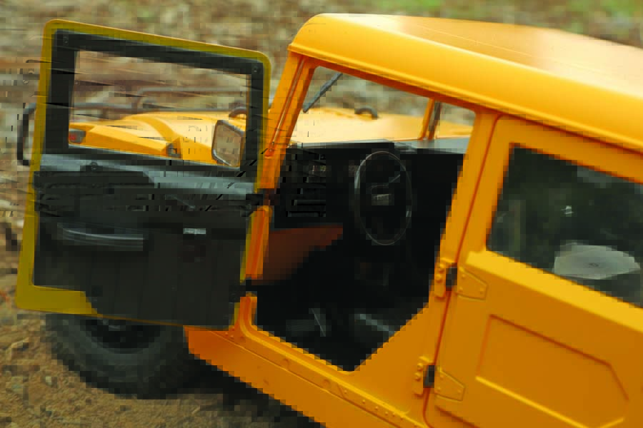 The Hummer features a realistic interior with authentic door hinges and latches that actuate the doors.