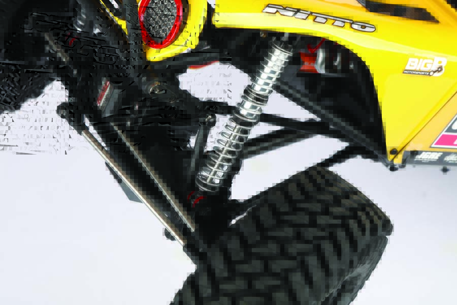 Dual spring alunminum body shocks provide this vehicle plenty of crawling capability a well as a smooth ride.