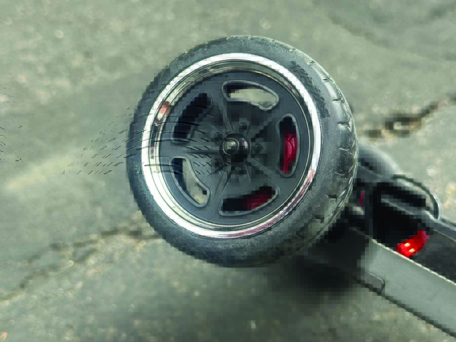 Staggered wheels and tires—wider on the rear than on the front—include replica cross-drilled rotors and calipers that can be mounted in forward or trailing positions.