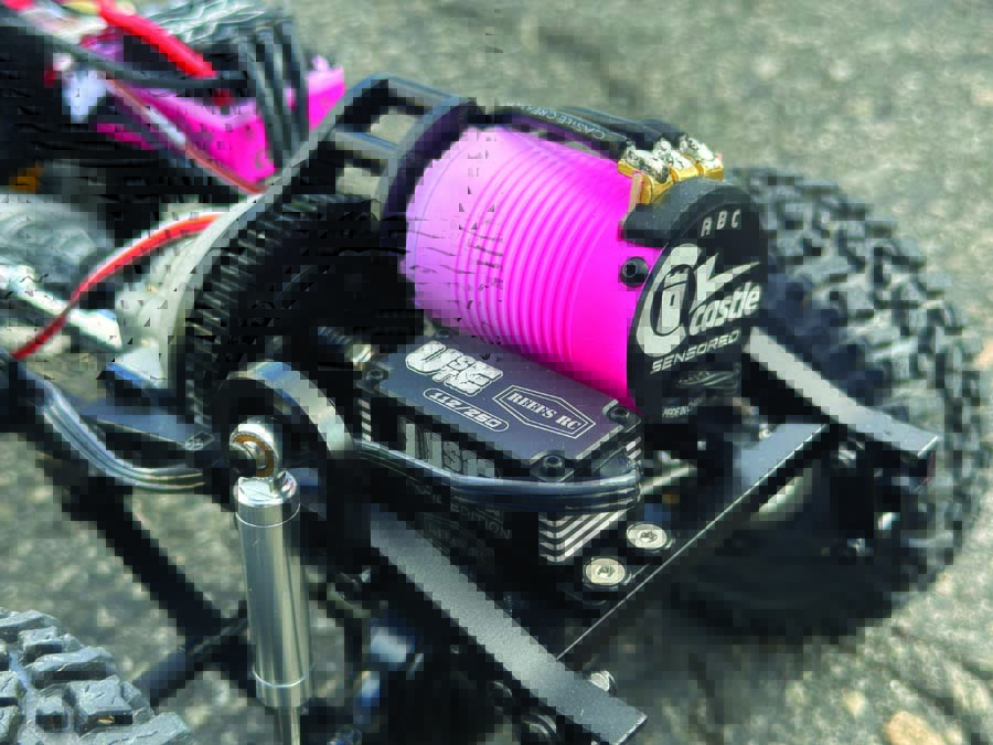 Major bling—a custom Cerakoted Castle Creations motor sits next to a limited edition USTE Reefs RC servo.