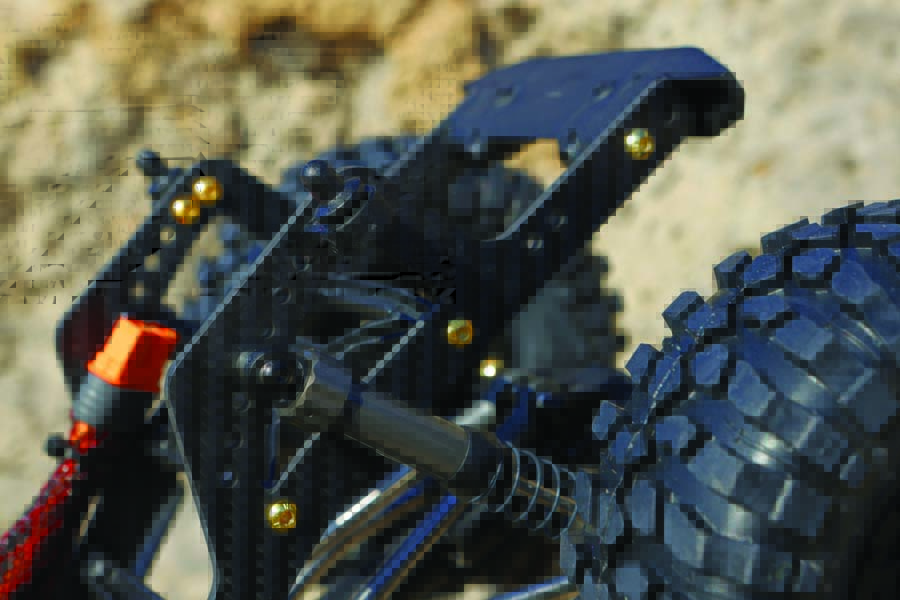 A close up on Axial’s SCX10 Pro Comp Crawler Carbon Chassis Rail Set.