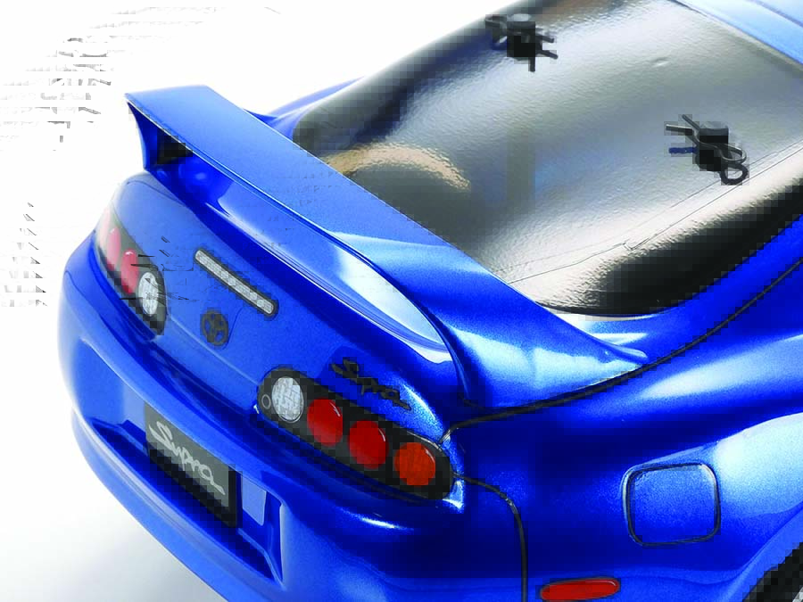 Separate molded plastic parts such as mirrors, light cases and this wing add to the Supra’s realism.