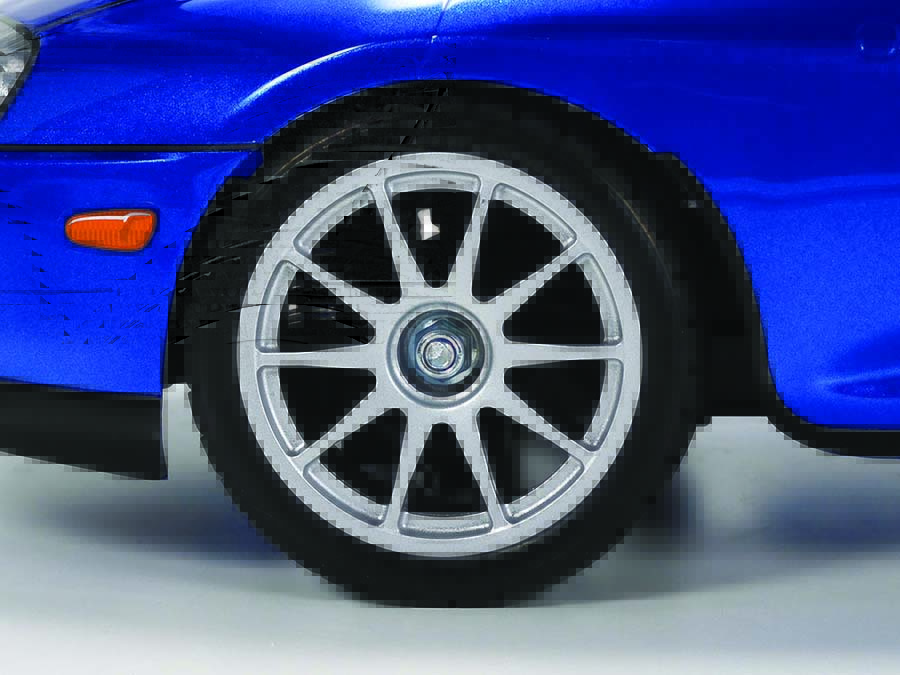 Tamiya radial street tires are paired with 10-spoke wheels that are reminiscent of tuner wheels of the JZA80’s era. 